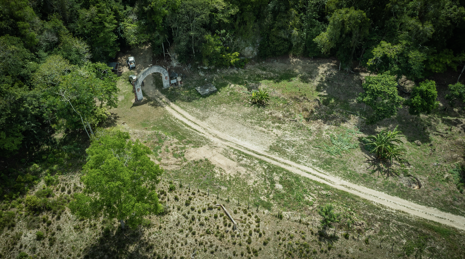 drone shot of road and entrance to forest Mayan Biosphere Reserve